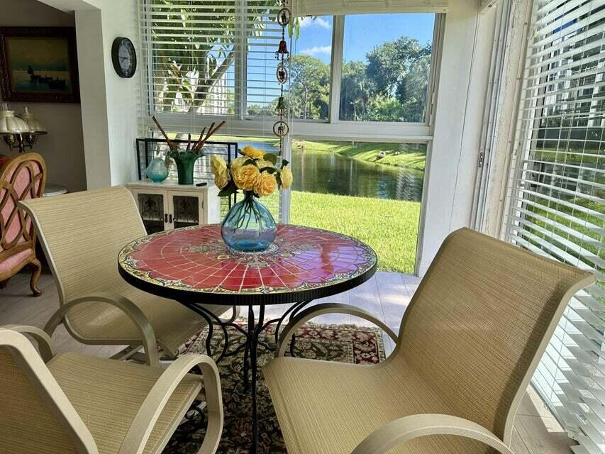 a view of a dining room with furniture window and outside view