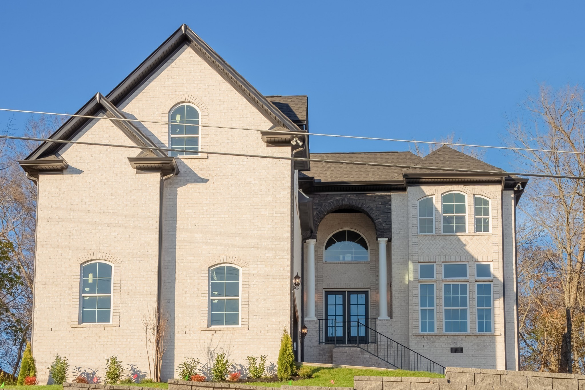 a front view of a house with a yard