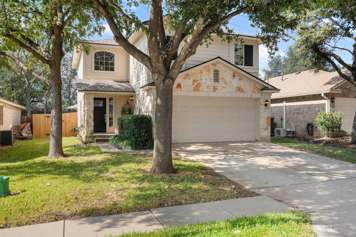 Beautiful Texas limestone exteroir with mature trees in the front and back. Look at that curb appeal!