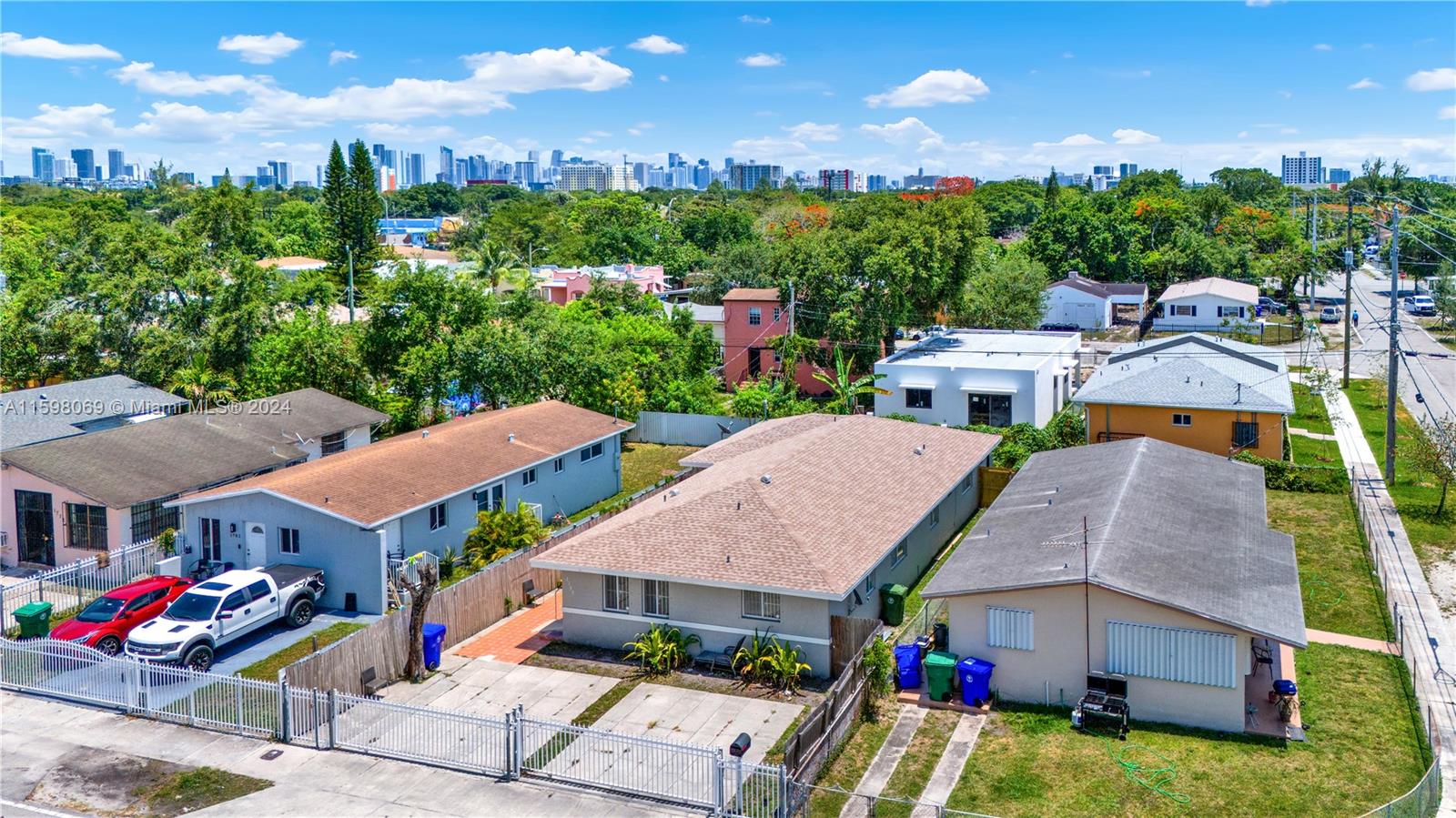 an aerial view of a house with swimming pool and ocean view