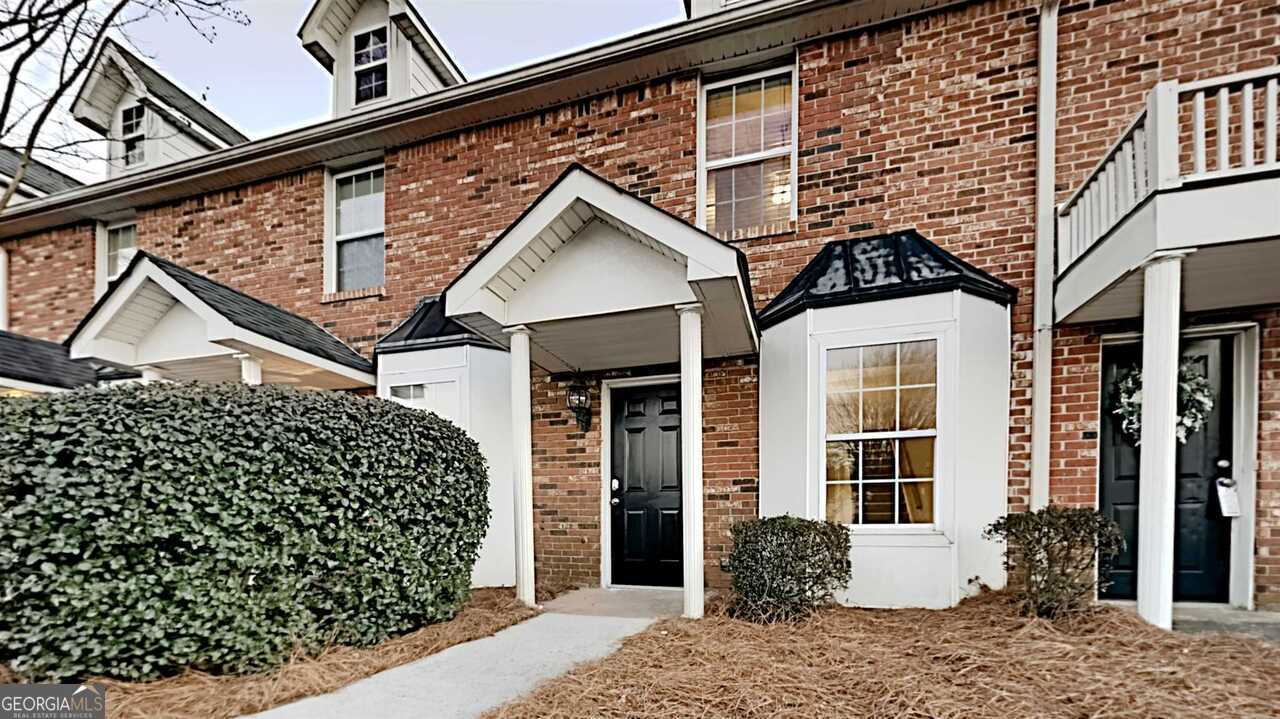 front view of a house with a large windows