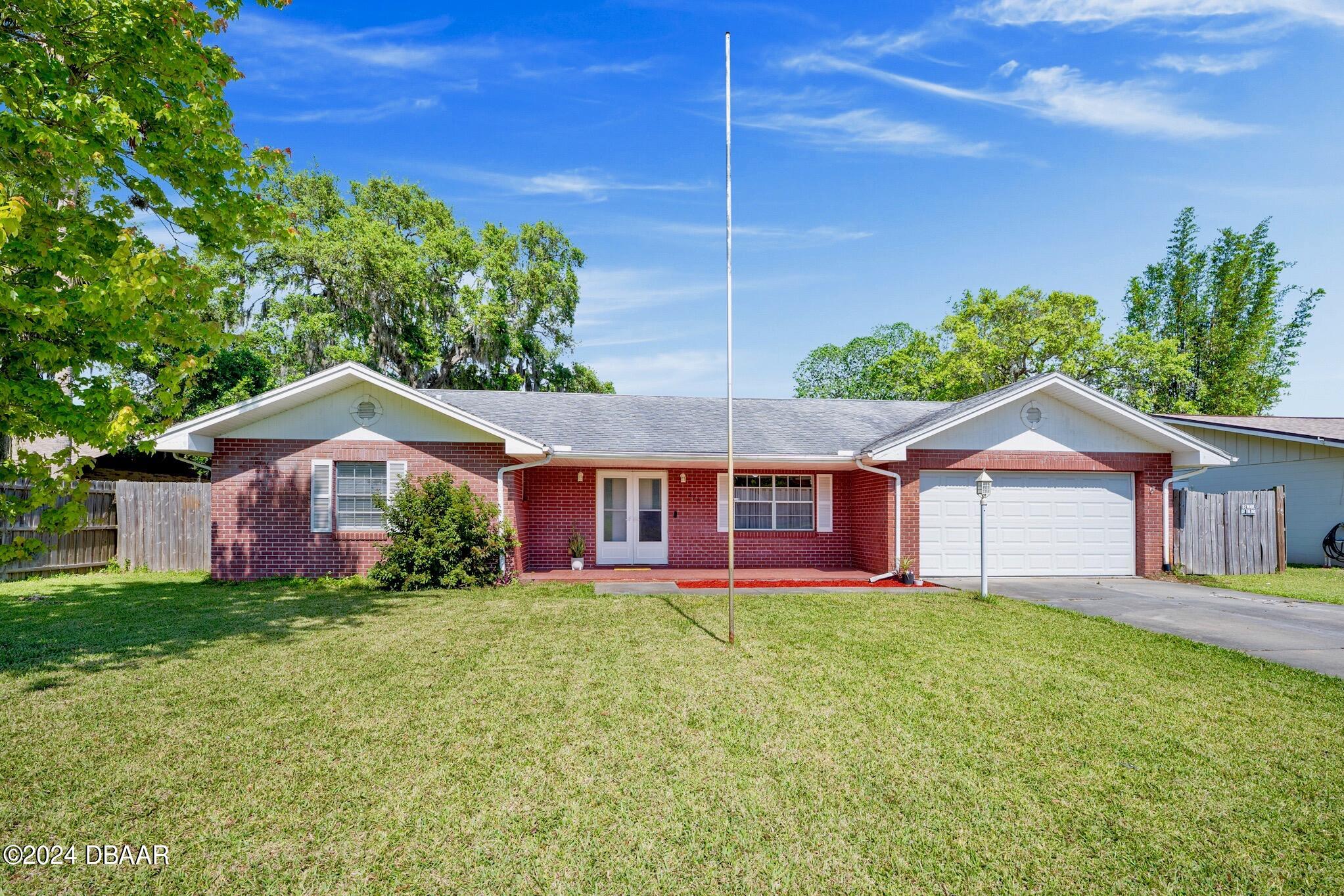 front view of a house with a yard