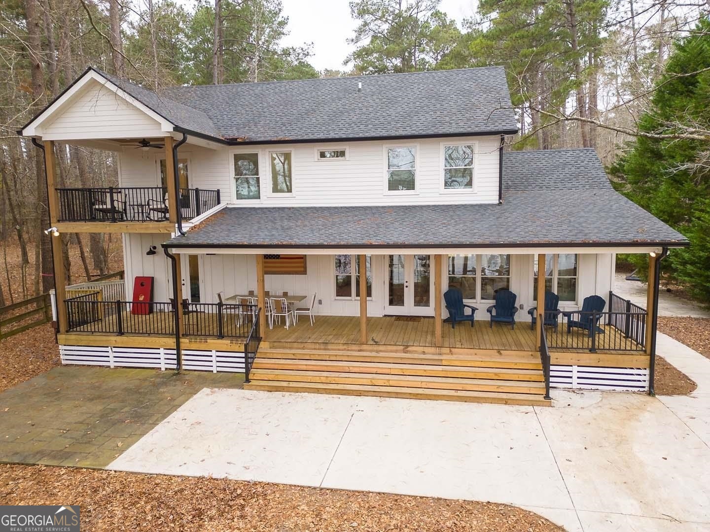 a view of a house with wooden fence