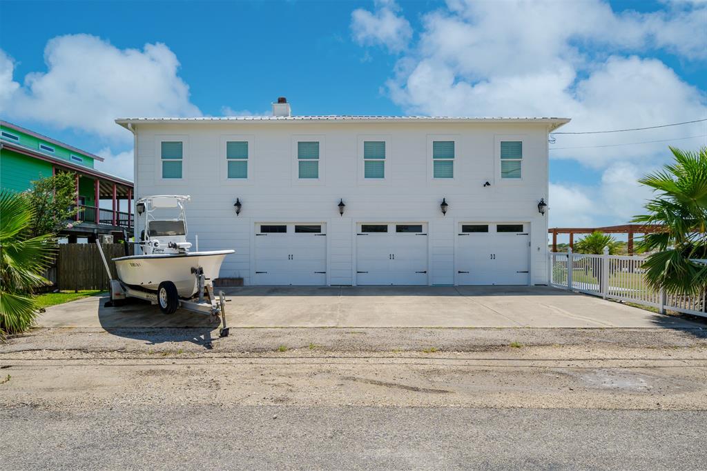 a view of a building with bench in front of house