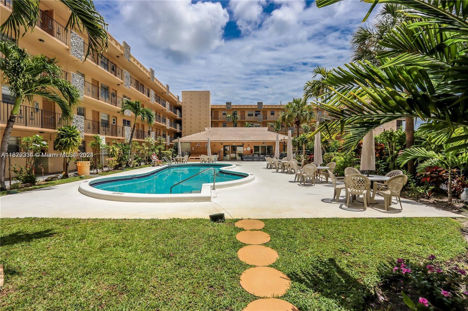 a view of a swimming pool with a patio