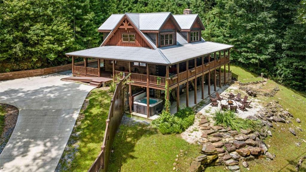 an aerial view of a house with a yard