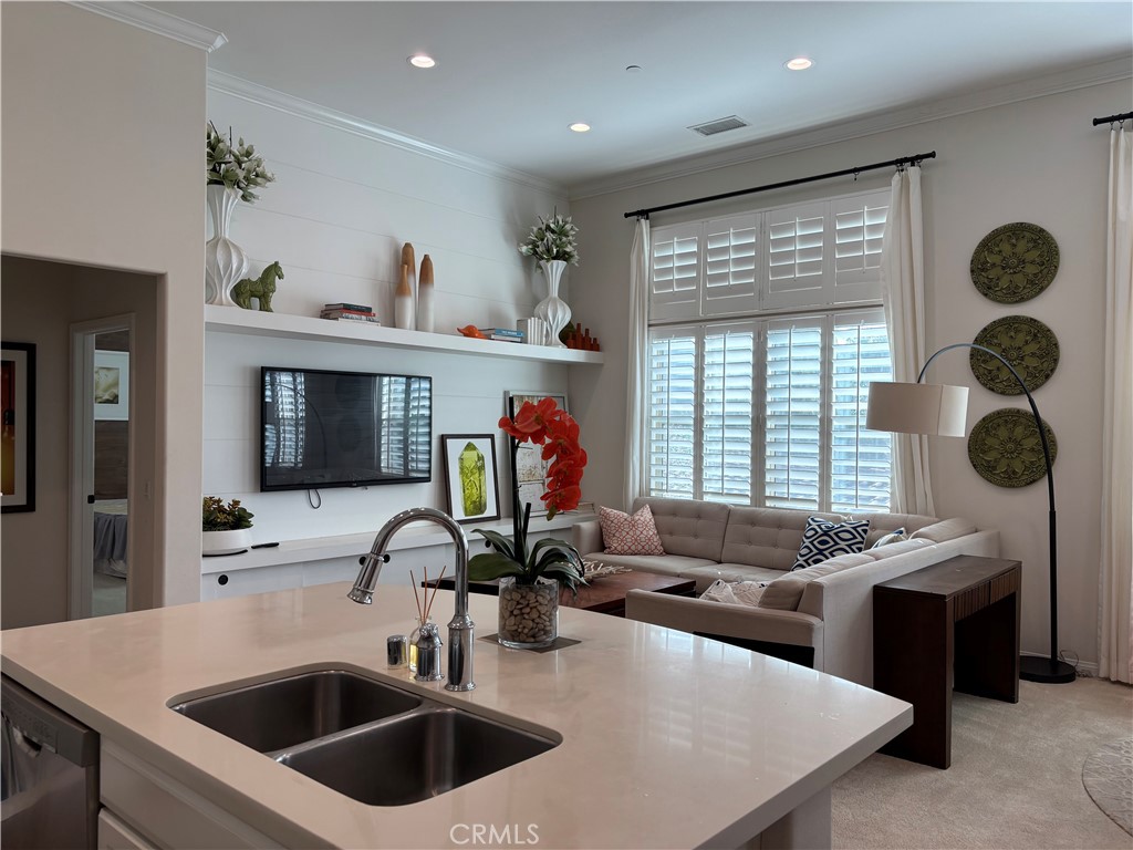 a kitchen with a stove a sink and a refrigerator