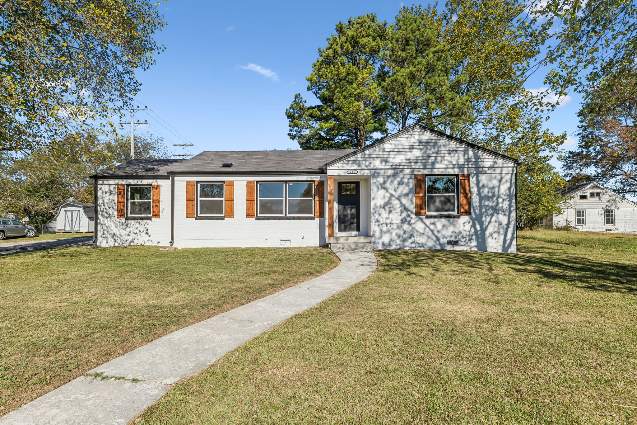 front view of a house with a yard