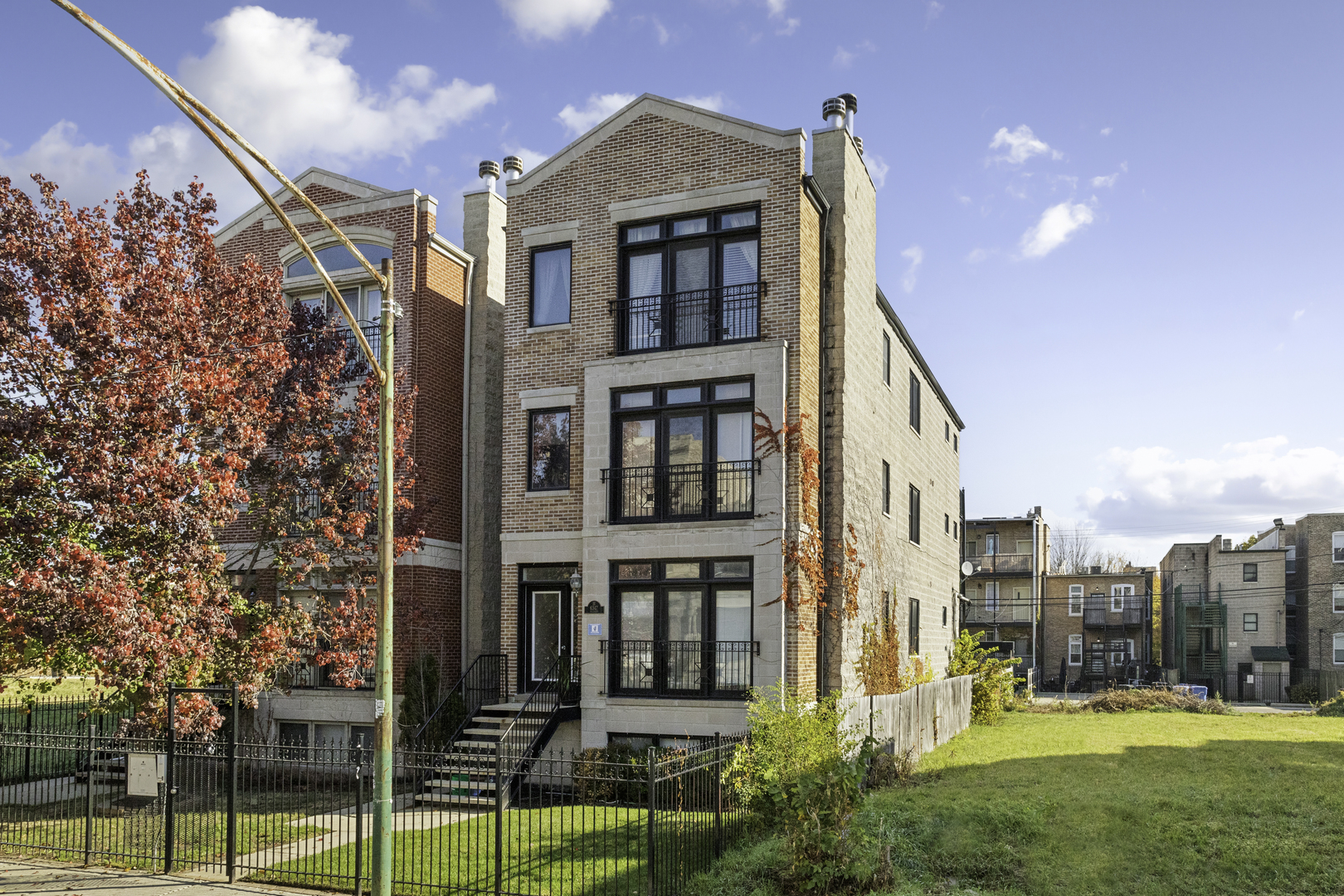 a view of a large building next to a yard