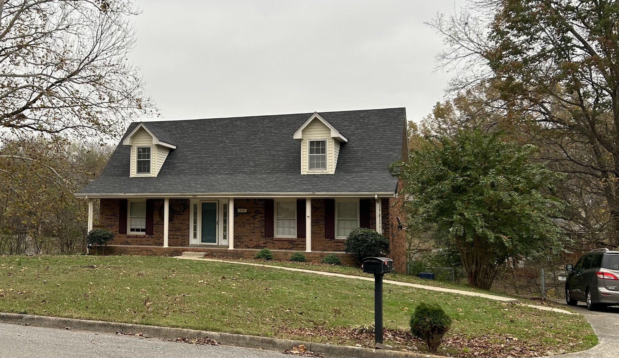 a front view of a house with a yard