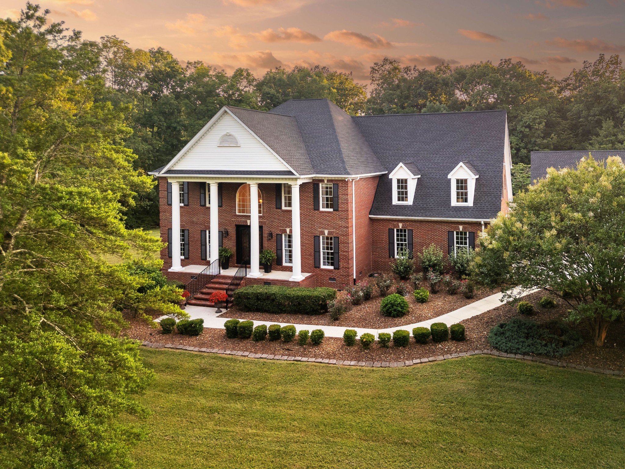 a front view of a house with swimming pool