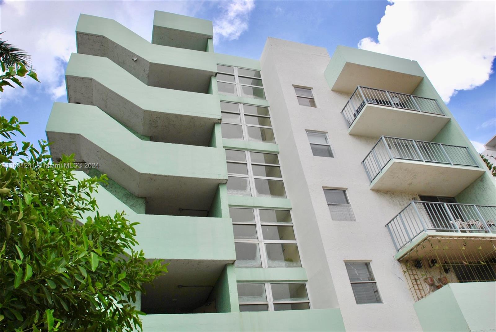 a view of balcony with furniture