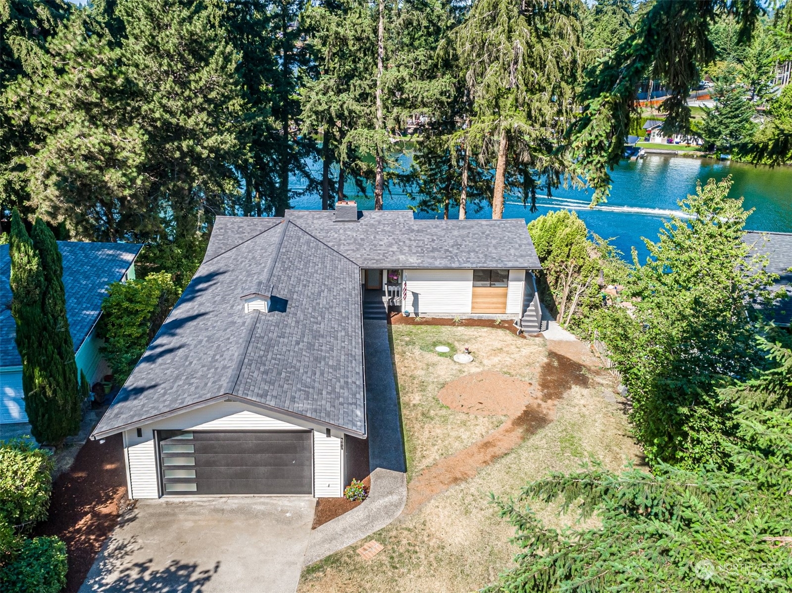 an aerial view of a house with a yard