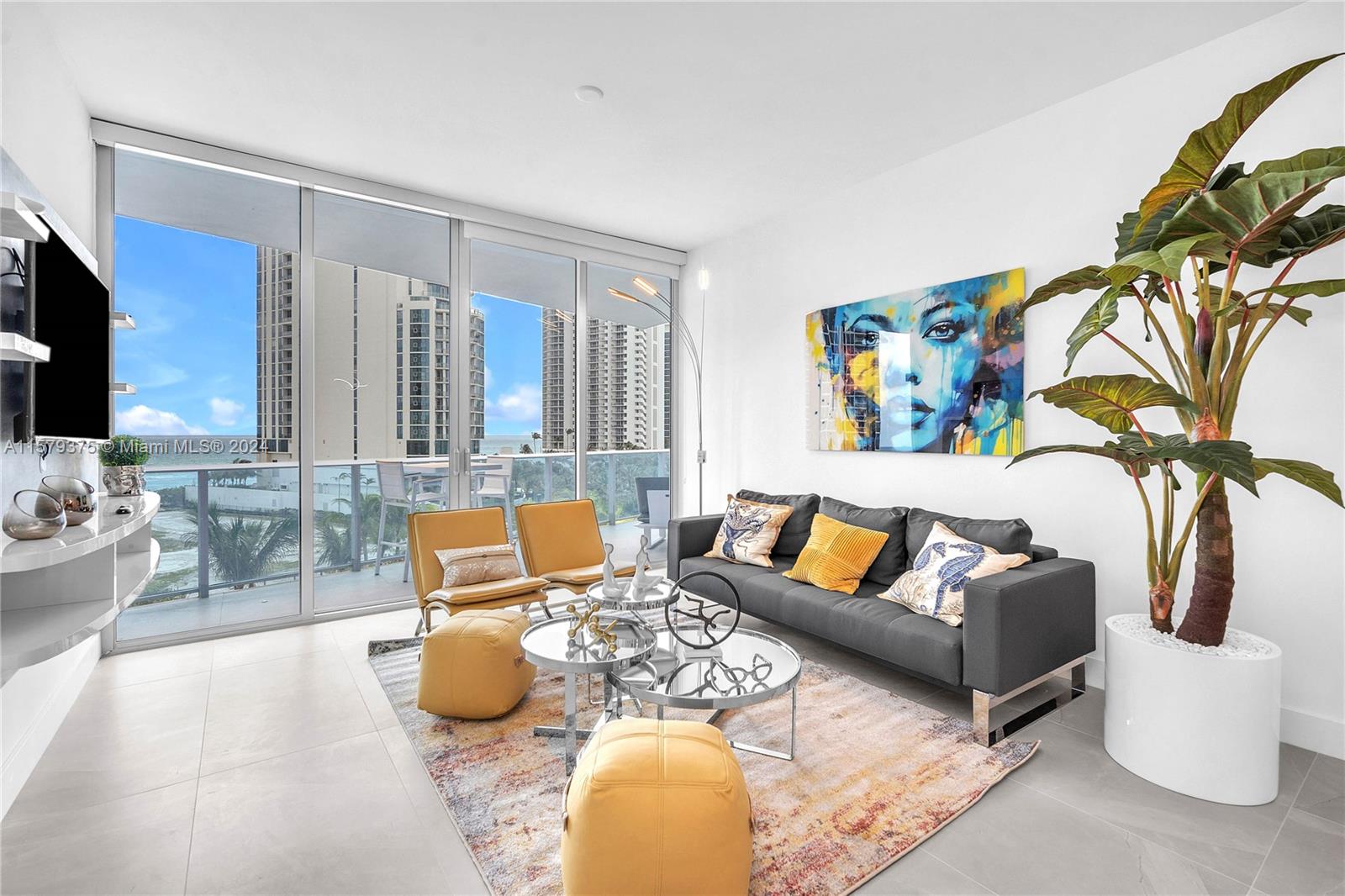 a living room with furniture and a flat screen tv