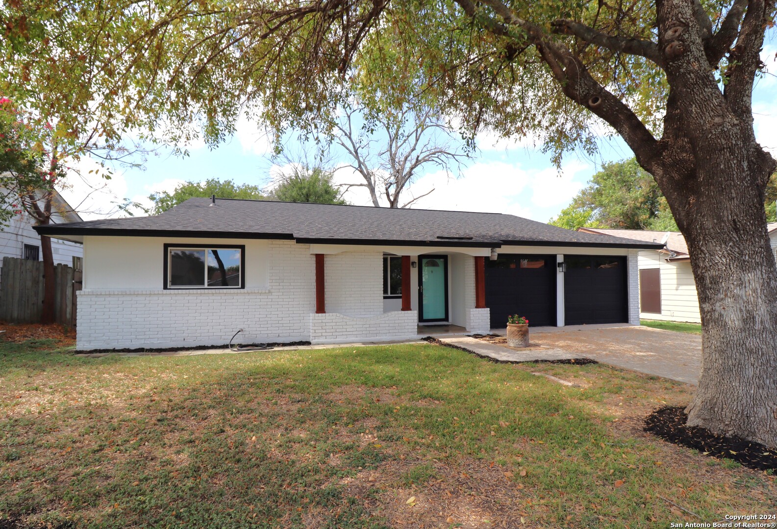 a front view of house with yard and seating area