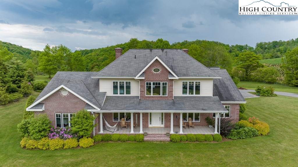 a aerial view of a house with a yard