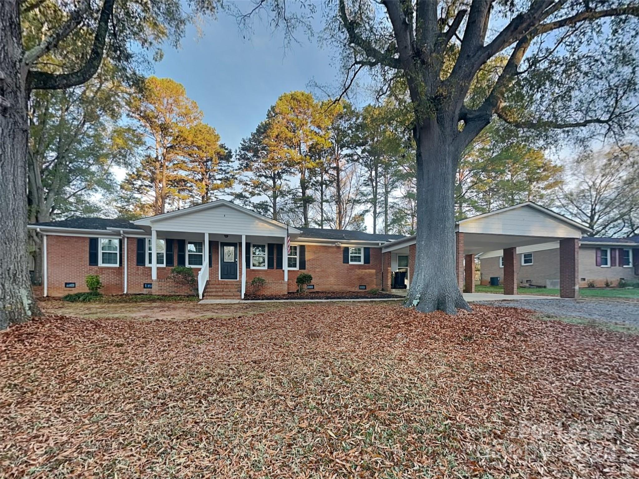 front view of a house with a tree