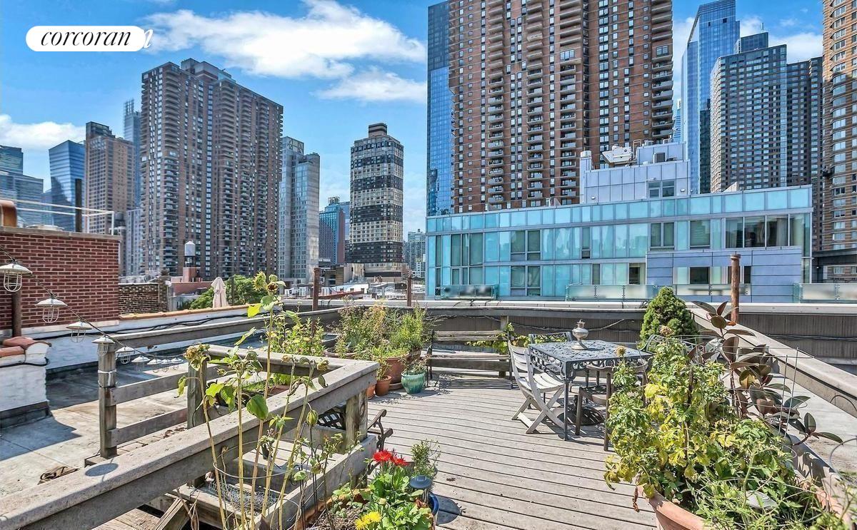 a view of balcony with outdoor seating and city view