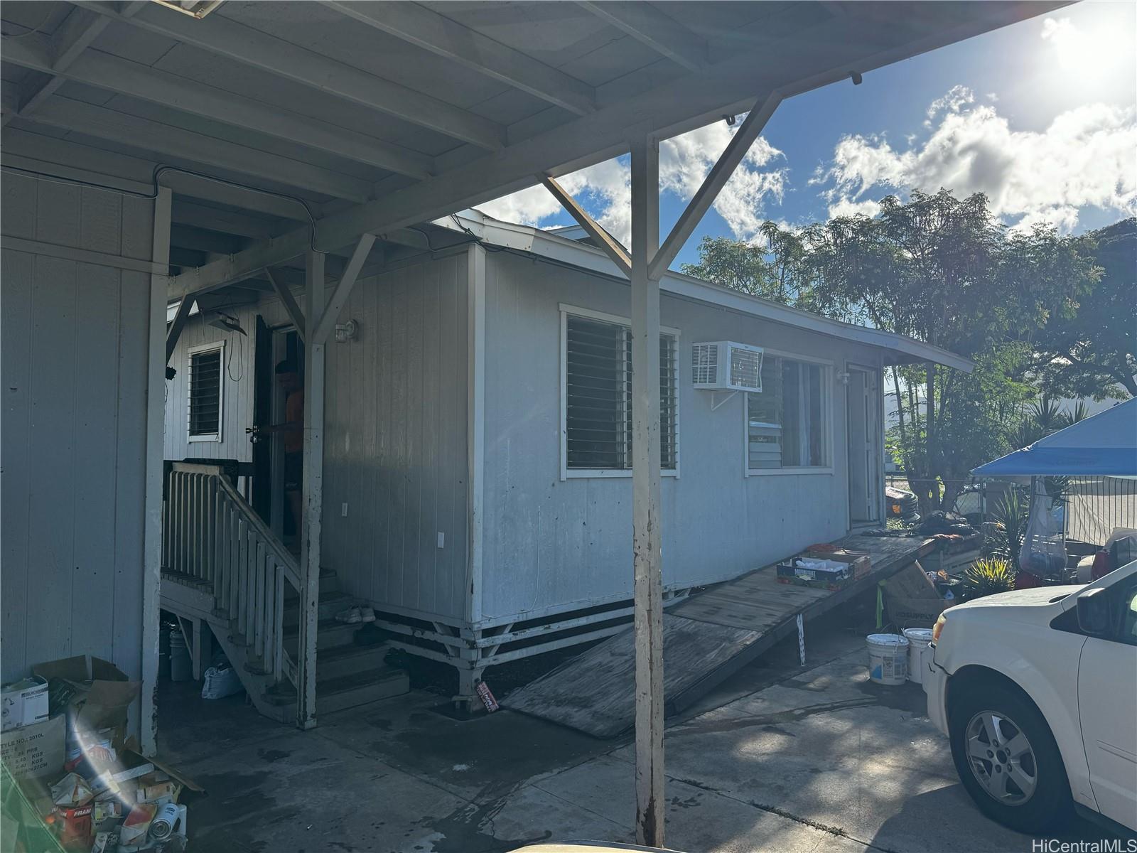 a view of a house with a backyard