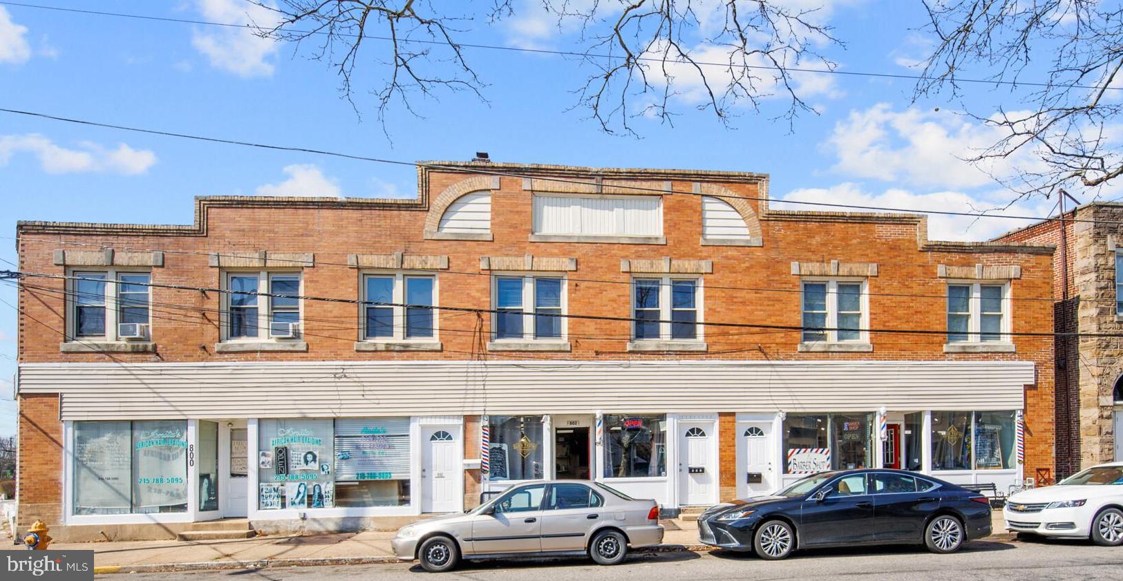 front view of a brick building with many windows