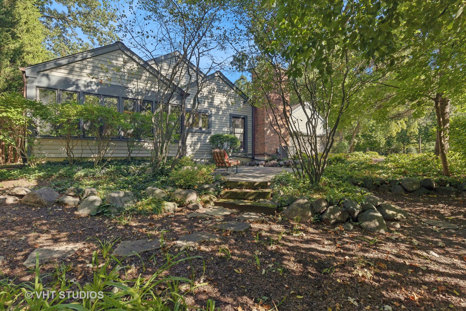 a backyard of a house with lots of green space