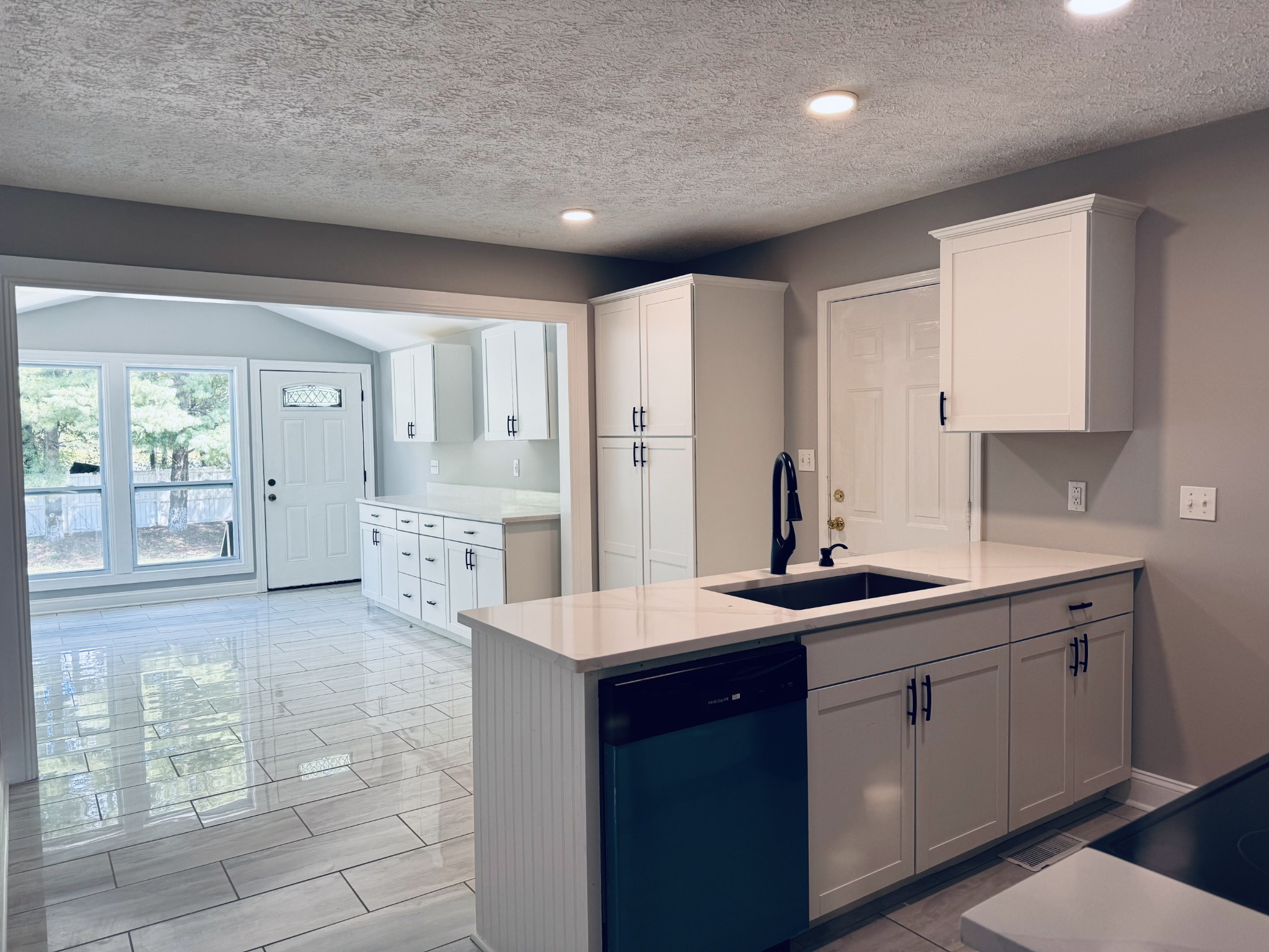 a kitchen with a sink and cabinets