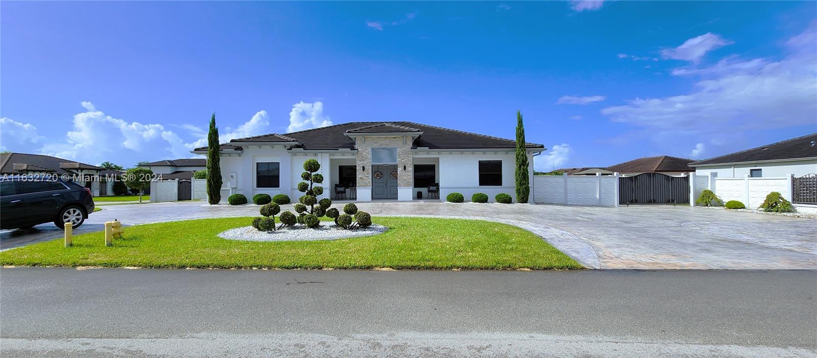 a front view of a house with yard