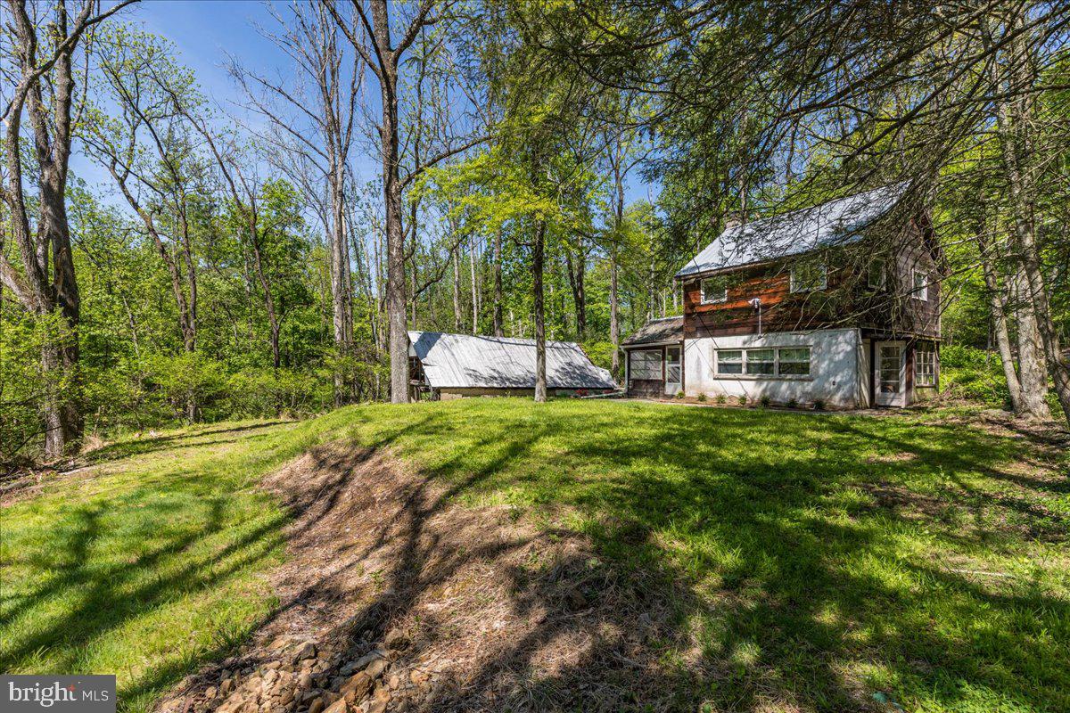 a backyard of a house with lots of green space