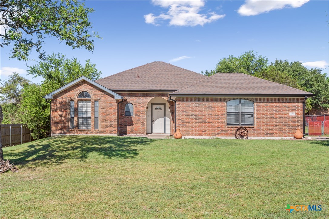 a front view of a house with a yard