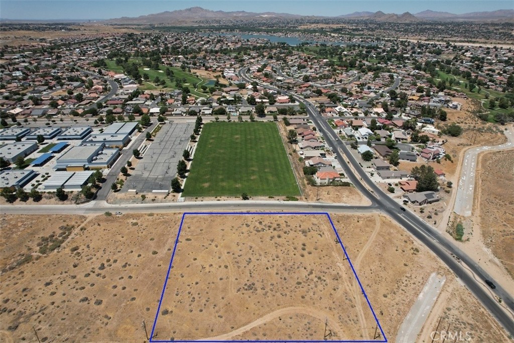 an aerial view of a residential houses with outdoor space