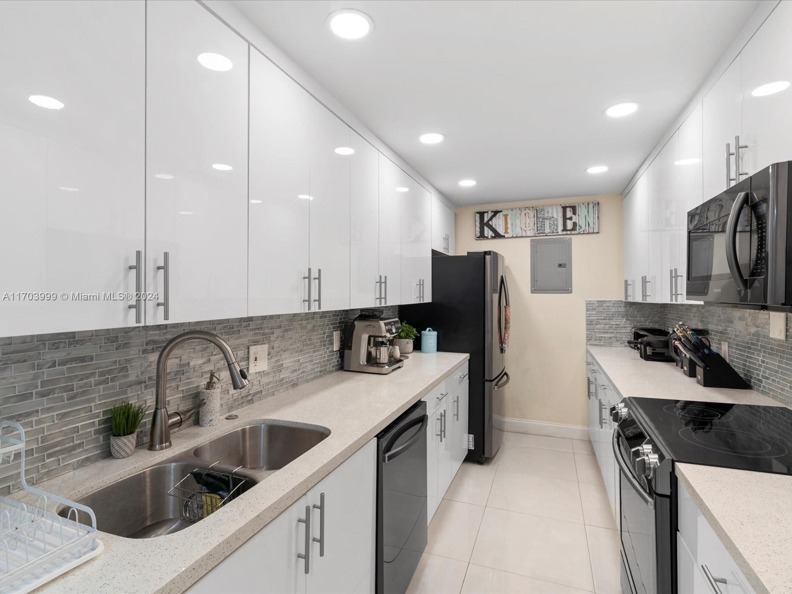 a kitchen with a sink stove and refrigerator