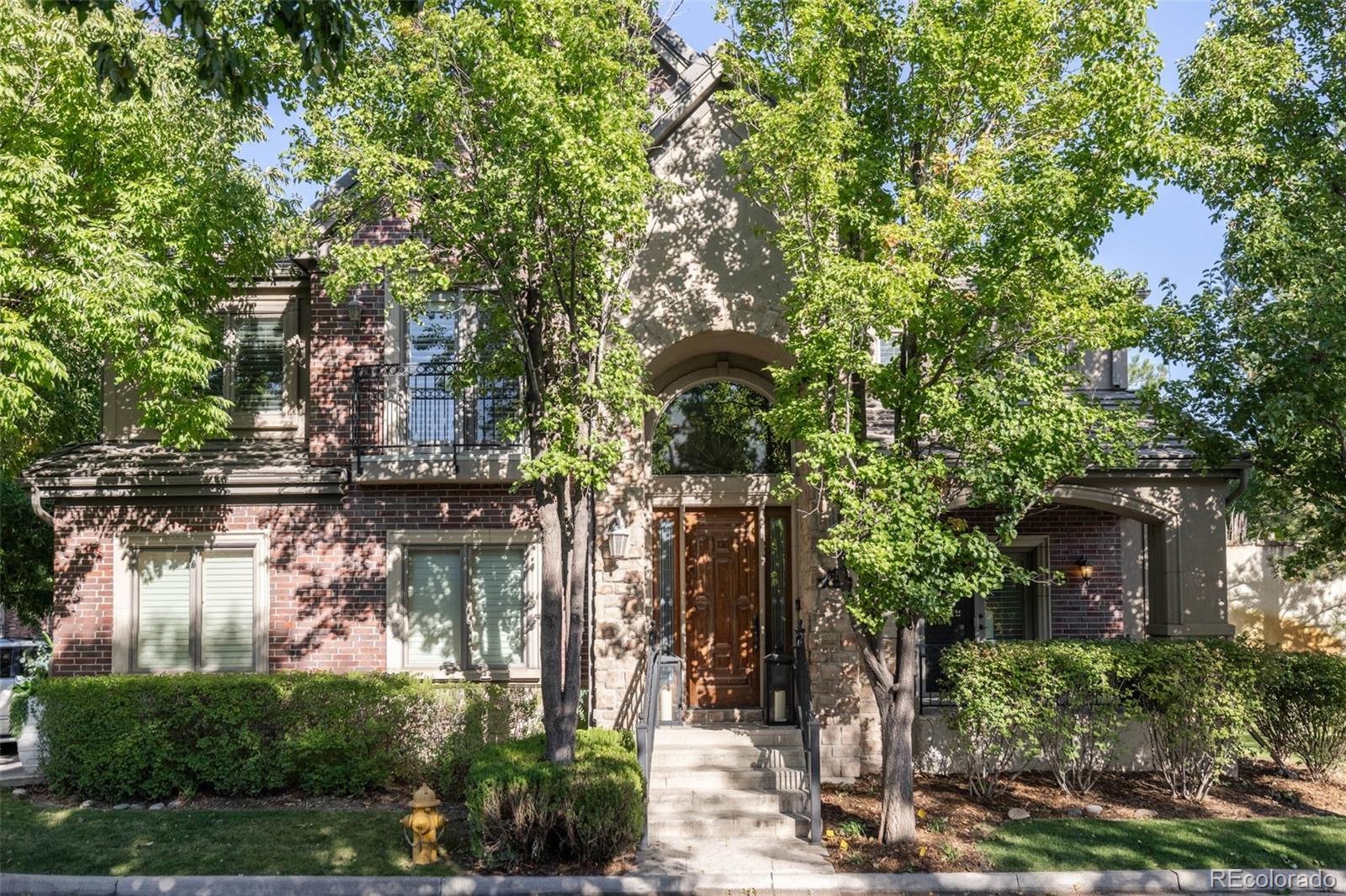 a view of a house with a tree in front