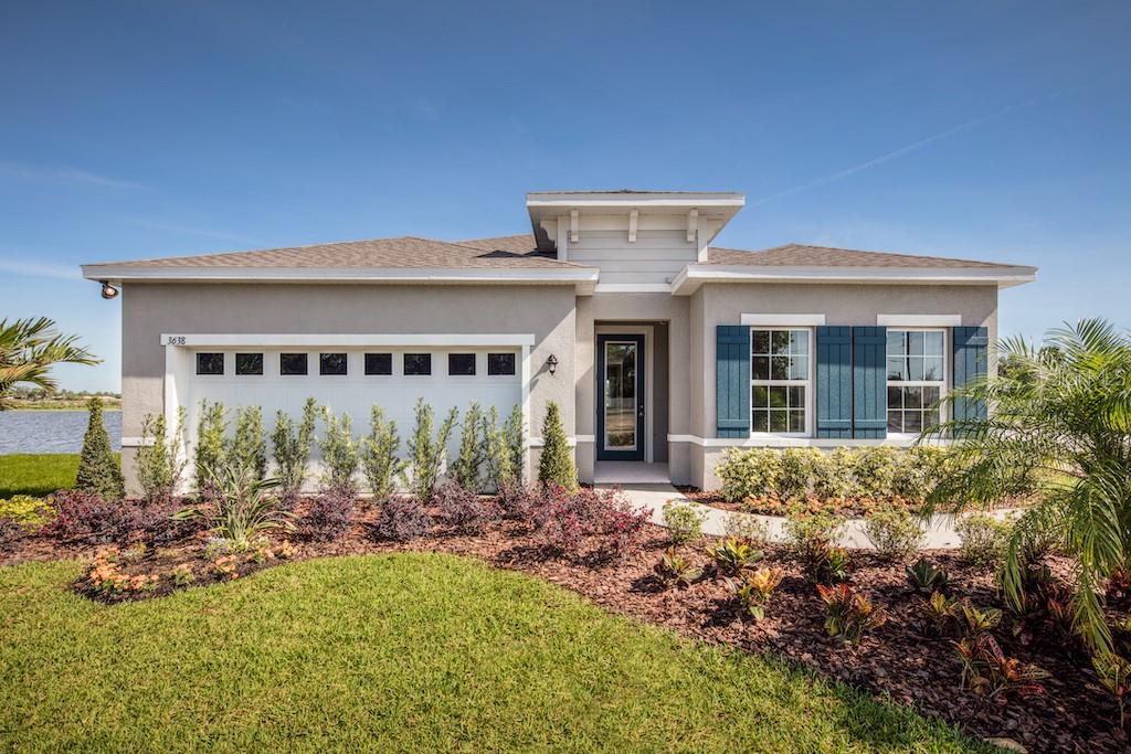 a front view of house with yard outdoor seating and barbeque oven