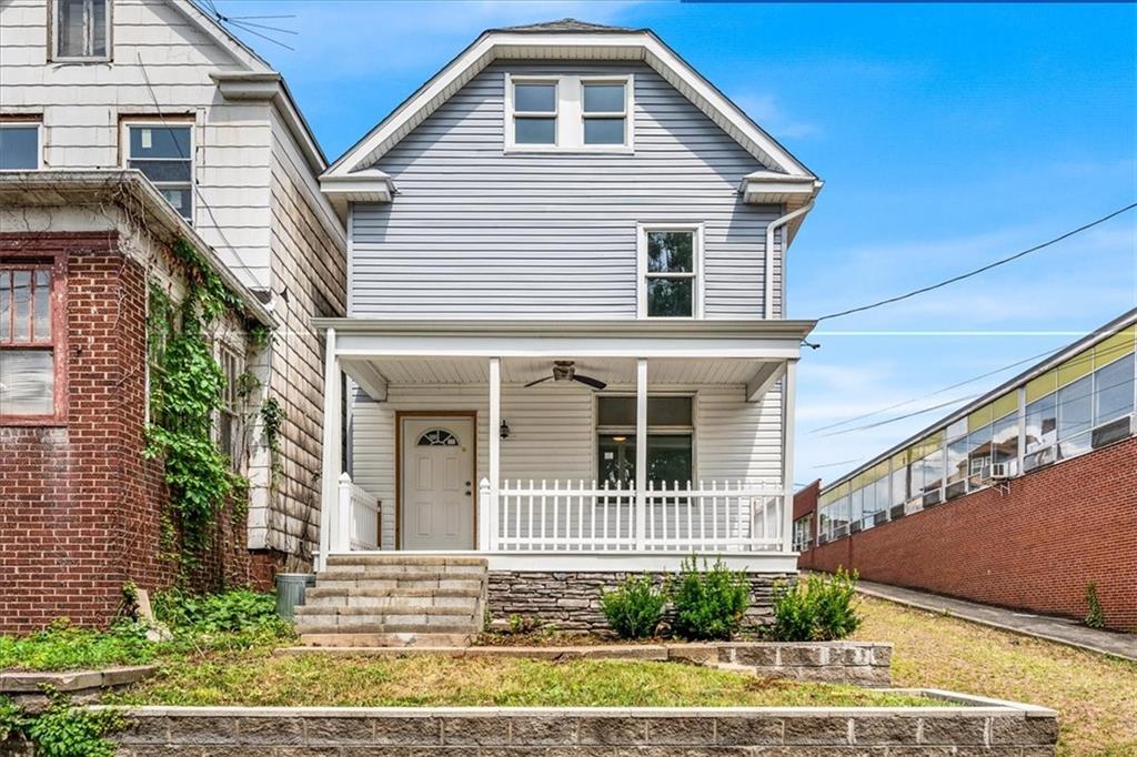 a front view of a house with a yard