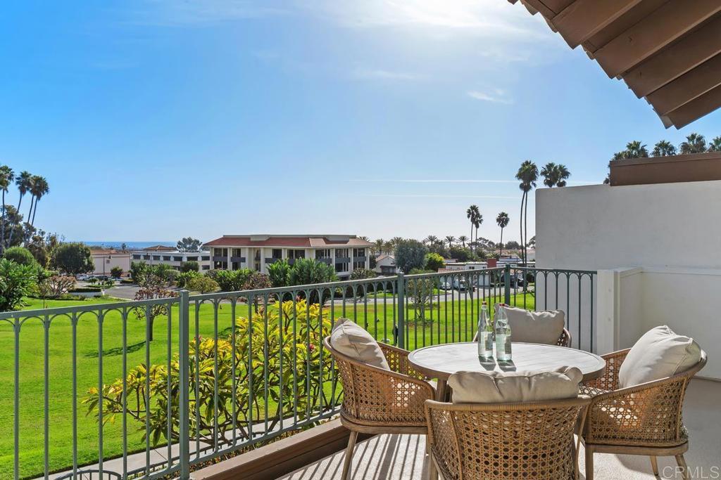 a view of a chairs and table in patio