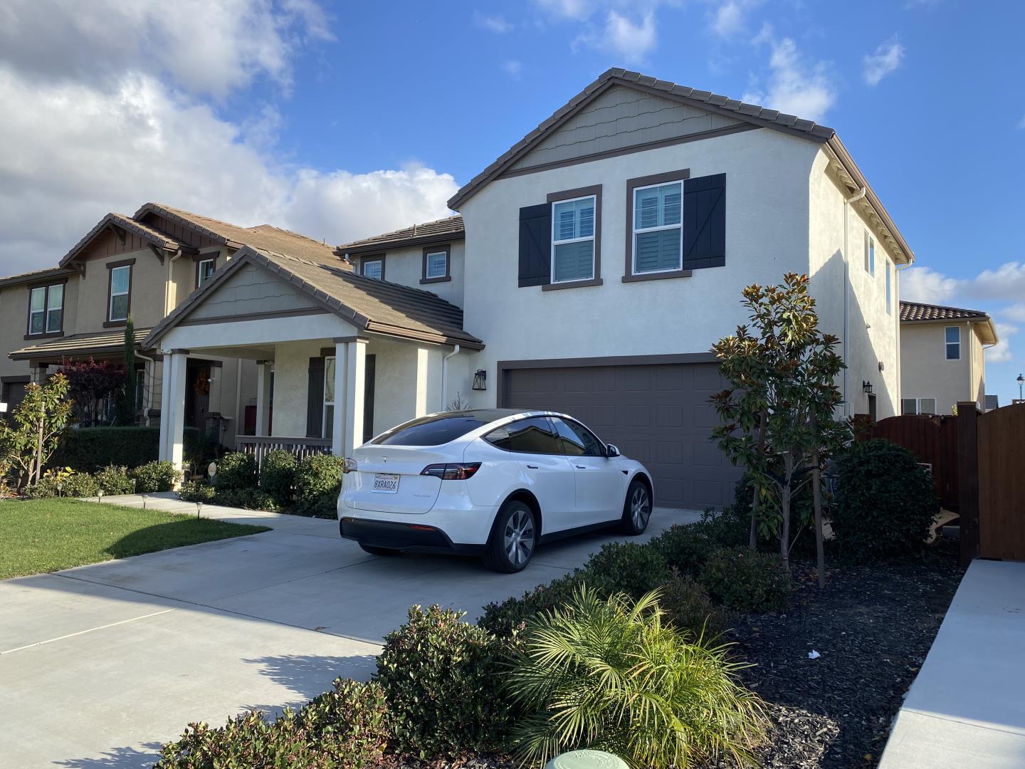 a front view of a house with garden