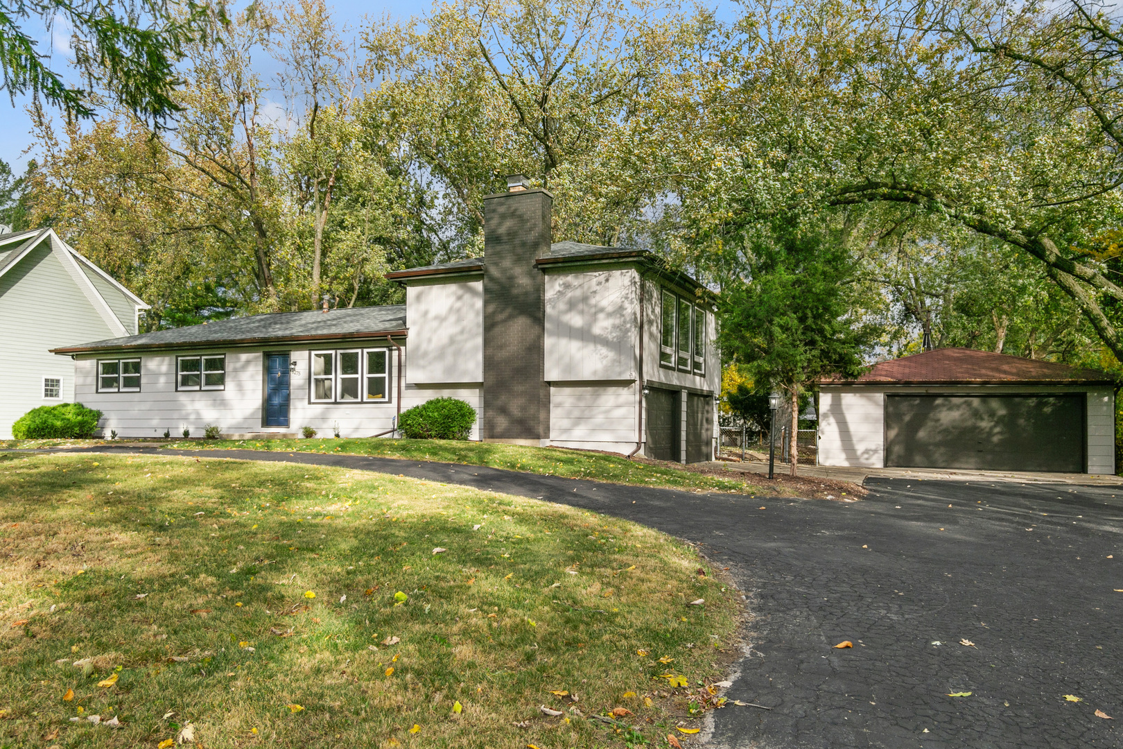 front view of a house with a yard