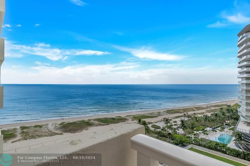 a view of a yard with an ocean view