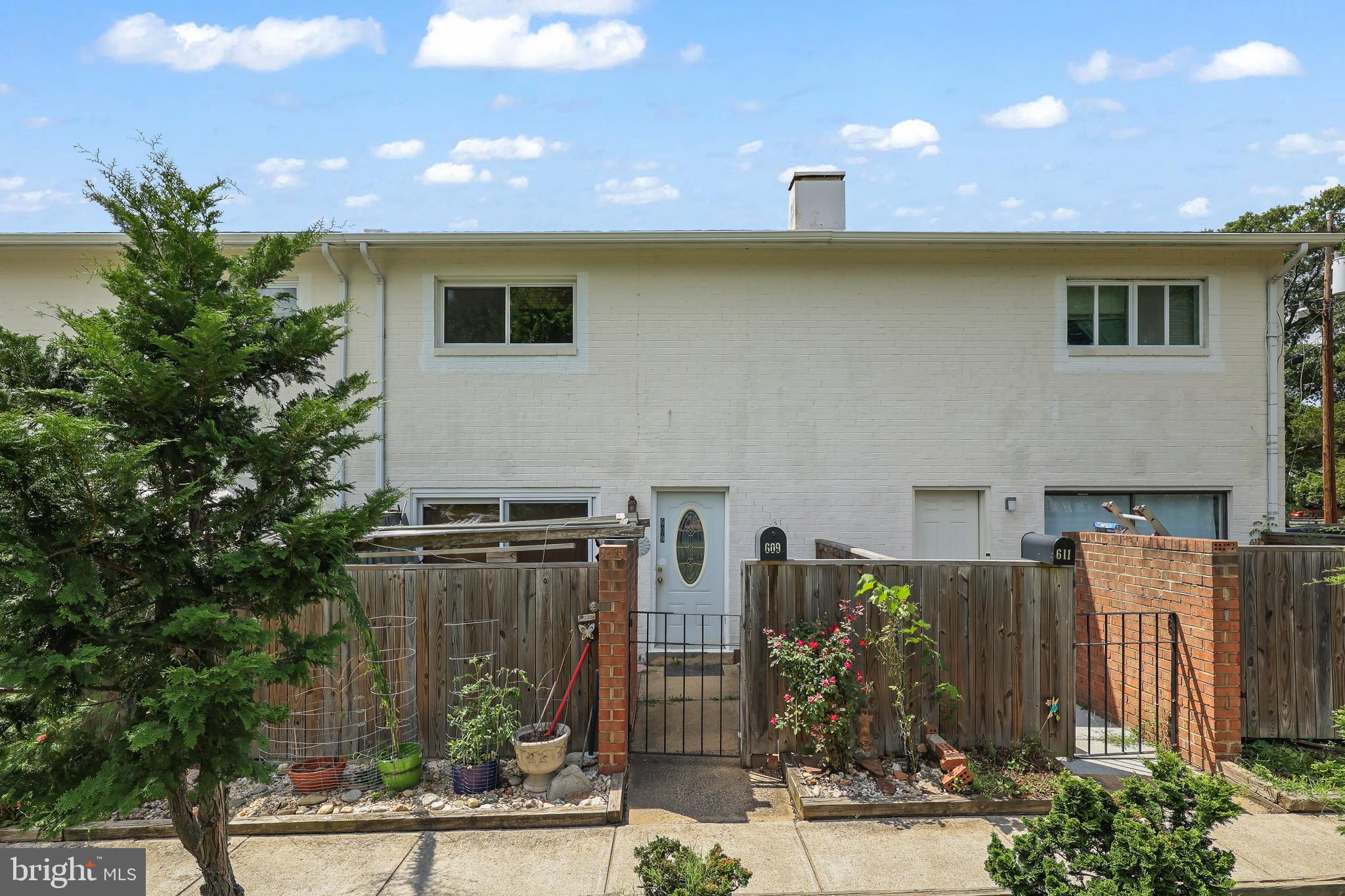 a front view of a house with basket ball court