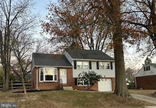 a front view of a house with yard