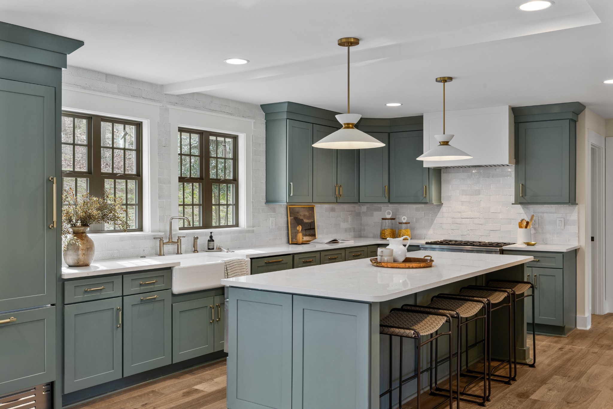 a kitchen with a sink a stove and a window