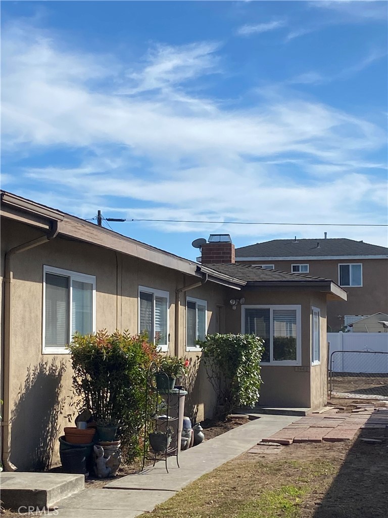 front view of a house with a bench