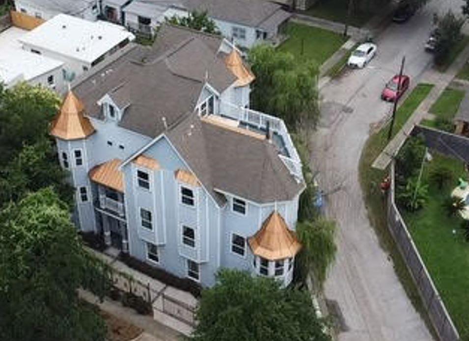 an aerial view of residential houses with outdoor space