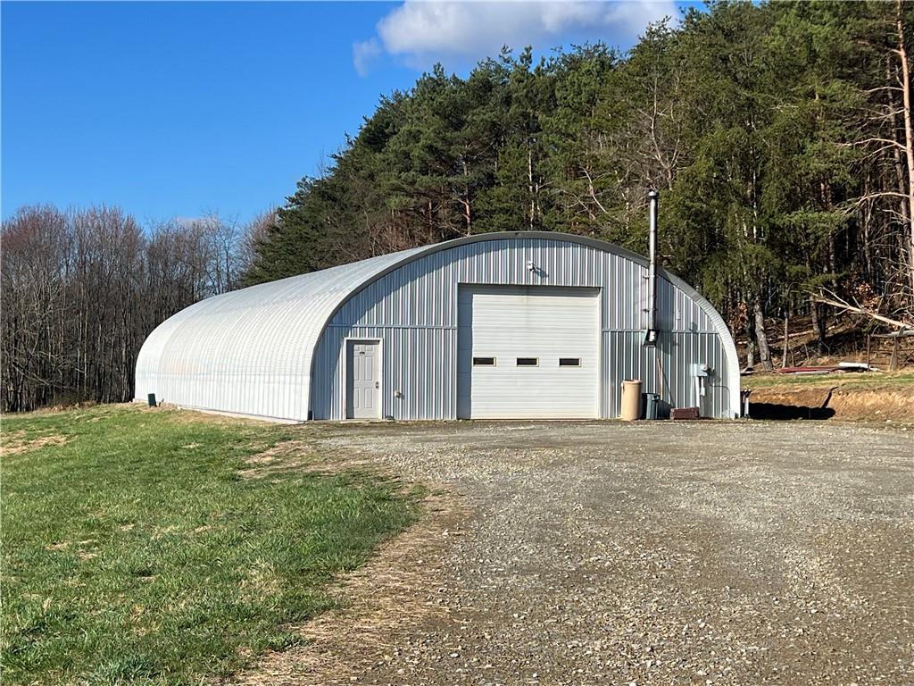 FRONT OF BUILDING WITH AMPLE PARKING