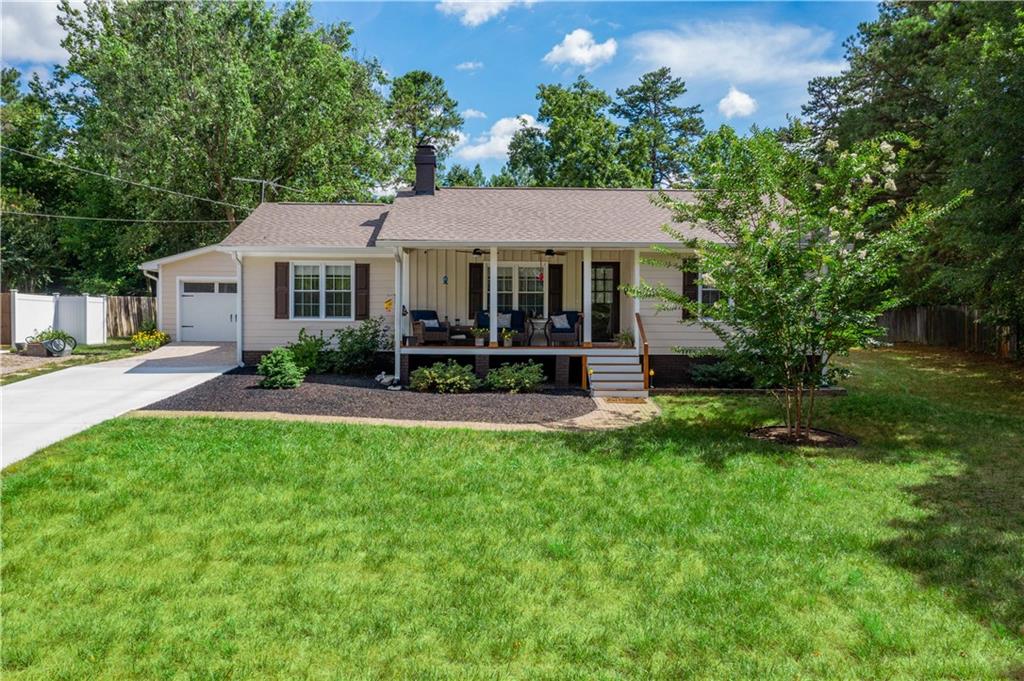 a front view of a house with garden