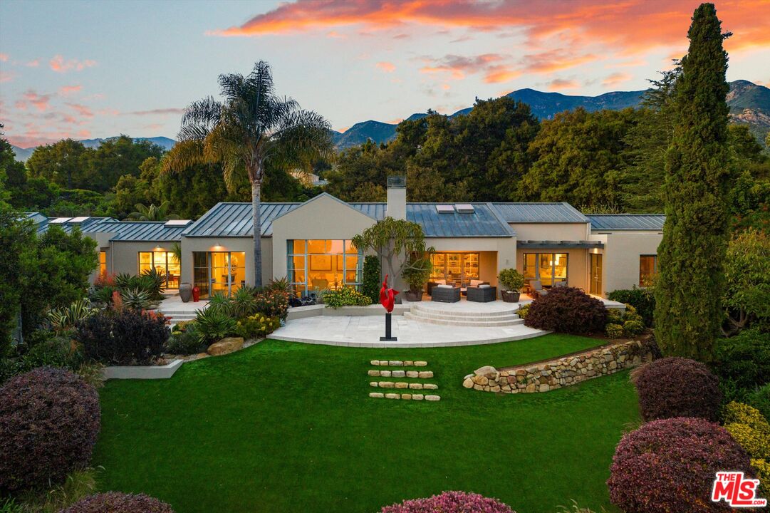 a view of a house and outdoor space and garden