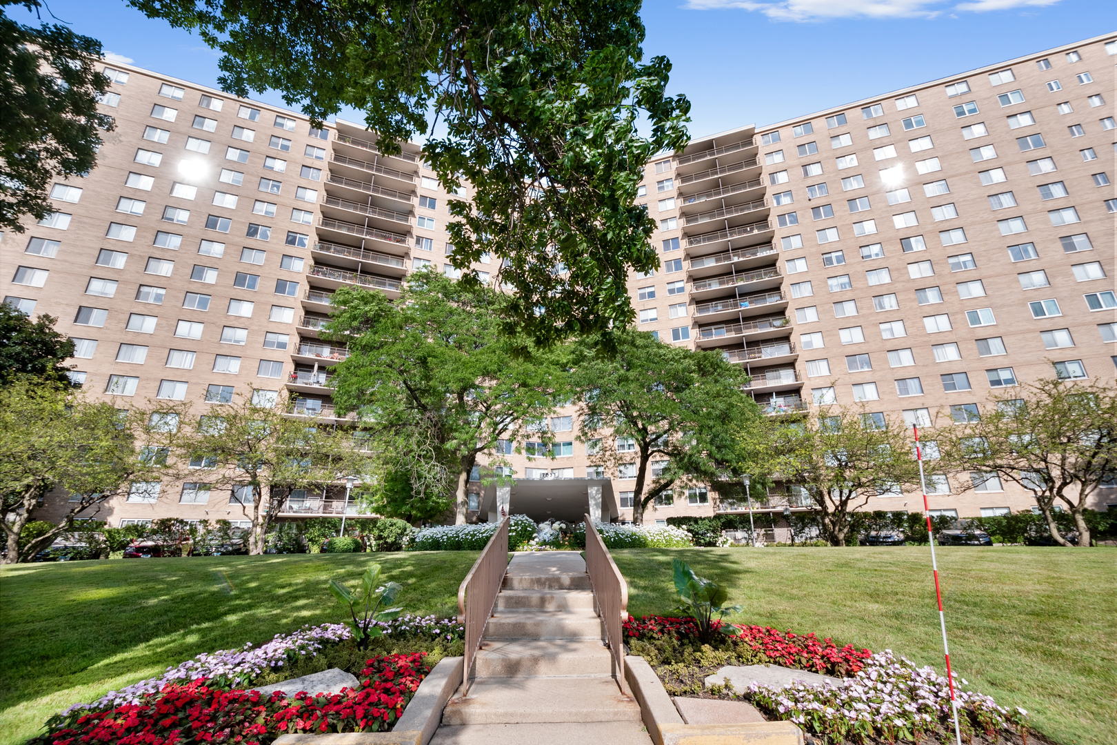 a front view of a building with garden