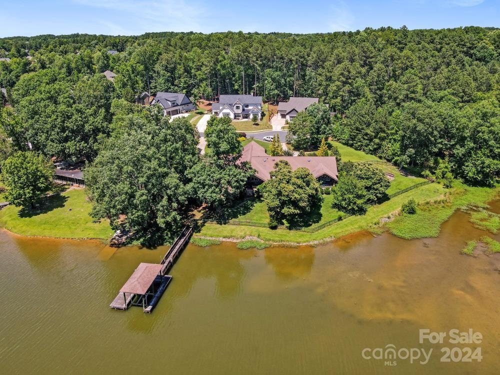 a view of a swimming pool with a yard