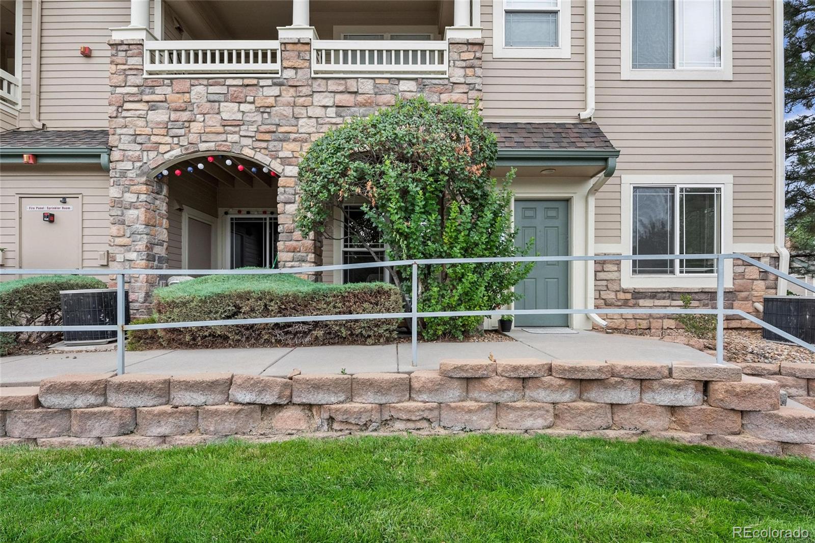 a view of house with a yard