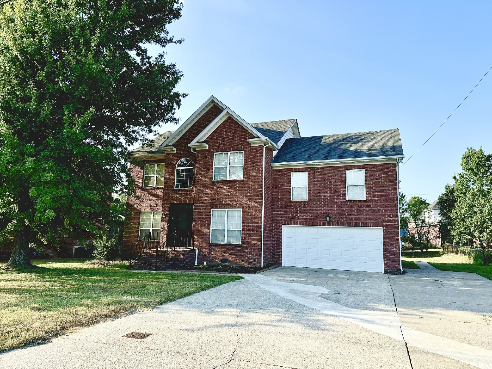 front view of a house with a yard